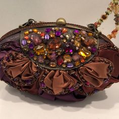 Gorgeous, Fits Phone, Displayed In Store. Extra Beads, Certicate Card, Duster Never Removed.Metals, Crystals, Beads Resin, Taffeta Leather , Sutach, Chain, All Artisan Made, One Of A Kind . Evening Wear , Yet Luncheon, Special Event , Showstopper.Any Flaws, Metal Mis Aligned Is All From The Company.Metal Is Not Shiny, Is A Darker Shades. Detachable Chain Can Be Worn As Necklace. Please Look At Pictures , Read Descriptions , Ask Questions. ,Bought In Europeas Is . Older Colleccions. Yet Timeless Luxury Purple Clutch For Evening, Purple Beaded Shoulder Bag For Party, Purple Chain Strap Shoulder Bag For Formal Occasions, Purple Beaded Party Shoulder Bag, Formal Purple Shoulder Bag With Chain Strap, Elegant Multicolor Embellished Bag, Purple Clutch Shoulder Bag For Formal Occasions, Formal Purple Clutch Shoulder Bag, Elegant Beaded Purple Shoulder Bag