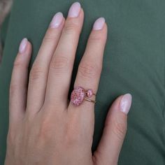 Delicate oval Rhodonite ring with tiny Rhodonite stone pieces captured in glass like resin in three crystal sizes. Bright ring is a perfect compliment to your everyday style. Beautiful by itself or in a stack. Every piece is hand made in our studio and always unique. Metal: 14k gold filled or Sterling Silver. Style: Oval 6x4mm crystal on a 1mm thick band. Size: Available in many sizes ready to ship. If you would like your ring made in a custom size feel free to reach out. Rhodonite Ring, Sparkle Jewelry, Ying Yang, Bracelet Collection, Delicate Rings, Crystal Rings, Everyday Style, Unique Rings, Ring Earrings