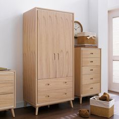 a bedroom scene with focus on the dresser, bed and teddy bear's chest