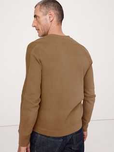 Our customer favorite Double-Knit fabric returns in heavier weight for added warmth.  Here, we added a classic henley neckline for a rugged, retro look that works well as a first or second layer.  Standard fit.  Organic: Made with 45% certified, organically grown cotton that's easier on the earth.  Crew neck with henley placket.  Straight hem.  Standard fit.  Long sleeves.  Hip length.  Model: Size M, 6'2" (188cm). Casual Henley For Winter Layering, Casual Winter Henley For Layering, Classic Cotton Henley For Winter, Classic Henley For Fall Layering, Classic Henley For Layering In Fall, Classic Winter Cotton Henley, Cotton Henley For Fall Layering, Casual Fall Henley Shirt, Casual Fall Henley