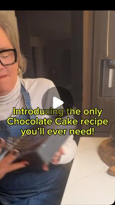 a woman holding a cake in front of her face with the words chocolate cake recipe you'll never need