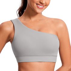 PRICES MAY VARY. Designed for yoga. Light support. Butterluxe collection features extremely soft and ultra stretchy, engineered for luxurious comfort. Removable pads for convenient adjustment. Unique right side one-shoulder design adds chic. Wide strap reduces shoulder pressure. Butterluxe collection features super soft and stretchy high-quality fabric. This one shoulder yoga bra wraps you in buttery softness. Look great with a pair of high waisted leggings or jeans. Perfect for summer.
 
 Featu Stretch One Shoulder Top With Built-in Bra, One Shoulder Top With Built-in Bra And Stretch, T-back Sports Bra With Medium Bust Support For Yoga, Compressive Sports Bra With Light Support And No-show Shape, Shoulder Yoga, Compressive Sports Bra With Built-in Bra In Gray, One Shoulder Bra, Yoga Light, Crz Yoga