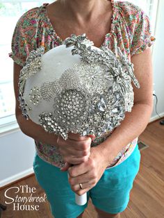 a woman holding a bouquet in her hands with the words the iron - rock house on it