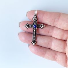 This listing is for a Vintage Silver Lapis Lazuli Cross Pendant. The pendant features a budded cross with balled silver and twisted wire granulation work. It has a round bezel set lapis lazuli stone at the center of the cross arms. Marks: 925 Weight: 3.5 grams Measurements: 1.7560 inches long and 1.0555 inches wide ❤All items in my shop are Estate, Vintage, and some even older which means they show age and wear consistent with being preloved.❤ ------------------------------- 👀 Click here to see Silver Beaded Cross Jewelry, Amber Heart, Engraved Cross, Stone Cross, Silver Crown, Lapis Lazuli Stone, Twisted Wire, Mini Heart, Shell Pendant