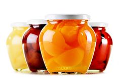 three jars filled with different types of jelly