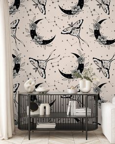 the wallpaper in this room is decorated with stars and crescents, which are painted on