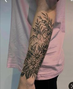 a person with a flower tattoo on their arm