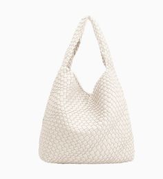 Woven vegan leather, the Kerry tote bag in Cream Ivory not only offers plenty of room for all your essential belongings but is also made of 40% post-consumer recycled polyester and 18% post-consumer recycled vegan leather. Making it chic and better for the environment. Color: Cream, Ivory Vegan Leather 15"W x 13"H x 5"D Handle Drop: 7.5" Magnetic Closure Removable Zip Pouch * Unlined Faux Leather Handbag, Heavy Bags, Woven Pattern, Vegan Bags, Zip Pouch, Tote Purse, Bag Set, Clothes Gift, Dresses With Leggings