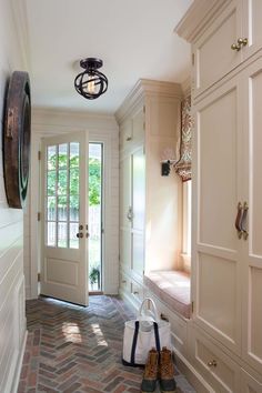 a pair of shoes sitting on the floor in front of a door and some doors