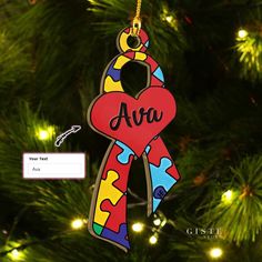 a personalized ornament hanging from a christmas tree