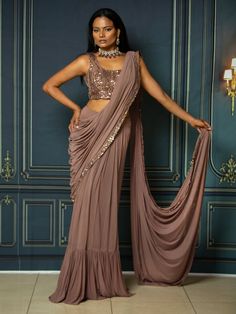 Color - Dusty brown Fabric & Work Style -- Stretchable f fabric. Details --Beautiful drapped saree with embroidered Jacket Assured quality.- Wash care instruction: Dry clean only.- Slight variation in color is possible due to digital photography. Embroidered Draped Dupatta For Diwali, Elegant Embroidered Draped Saree, Designer Wear Draped Dupatta With Mirror Work, Designer Draped Dupatta With Mirror Work, Designer Mirror Work Draped Dupatta, Festive Embroidered Draped Blouse Piece, Designer Wear Draped Sharara With Resham Embroidery, Embroidered Draped Dupatta For Party, Designer Embroidered Draped Saree