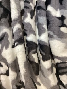 the fabric is made with grey and white camo print, it looks like something out of