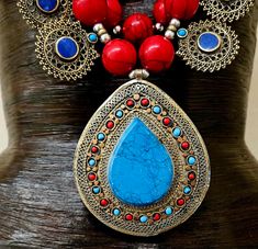 Since this is an older piece, I am open to considering reasonable best offers. Please email me. _____________________________________________________________________________________________ This stunning, jaw drop creation is from my private vault, and unworn. It is a big, bold, chunky and heavy beaded chest piece comprised of red, blue and green magnesite round beads with shiny silver tone metal balls. 12 lapis lazuli fancy filigree charms are suspended from the outer most strand and a blue and Red Bohemian Necklace With Large Pendant, Handmade Necklaces For Festivals, Red Pendant Beaded Necklace For Festivals, Traditional Multicolor Beaded Necklace With Large Pendant, Traditional Red Pendant Beaded Necklace, Traditional Red Beaded Pendant Necklace, Red Large Pendant Jewelry For Festival, Red Bohemian Jewelry With Intricate Design, Bohemian Blue Necklace With Intricate Design