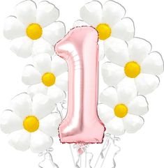 a pink number one balloon surrounded by white daisies