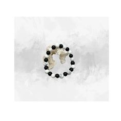 Embrace the versatility of our one of a kind Onyx 8mm and Howlite 8mm Stretch Bracelet. This beautiful bracelet serves as a beacon of tranquility and strength, making it the perfect accessory that symbolizes balance and harmony. The white Howlite beads expertly paired with the glossy Onyx promises not just a visually pleasing piece, but an element of tranquility and grounding energies. Each bead measures 8mm, balancing perfectly on the wrist for a comfortable and timeless fit. This bracelet is crafted carefully, with each bead being handpicked and threaded onto a durable elastic band, ensuring a flawless finish that will last for years. As each piece is one of a kind, this is more than an accessory - it's a personal statement. Whether as a gift for a loved one or a treat for yourself, this Black Hypoallergenic Stretch Bracelet With Round Beads, White Spiritual Jewelry With Black Beads, Spiritual White Bracelet With Black Beads, Balance And Harmony, Visually Pleasing, Personal Statement, Onyx Bracelet, White Howlite, Stretch Bracelet