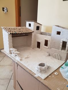 a model of a house made out of clay