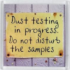 a yellow sign that says dust testing in progress do not disturb the samples