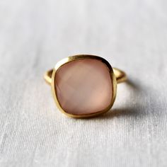 D E T A I L S - Material: 925 Sterling silver Stone: Pink Chalcedony The fit: True to US ring size Finish: Textured and Gold Plated to a high shine S H I P P I N G & P R O D U C T I O N - My current production time is 2-6 business days, which means after those days are up, your order ships! I make everything custom to order, by hand, but I promise you it's worth the wait! R U S H - M Y - O R D E R - If you're in a rush to get your pretty new pieces, please send me a message and I'll let you Classic Pink Cabochon Rings, Pink Cabochon Ruby Ring Gift, Adjustable Round Chalcedony Ring, Pink Sterling Silver Crystal Ring, Elegant Pink Ruby Cabochon Ring, May Birthstone Rings, Chalcedony Ring, Citrine Ring, Proposal Ring