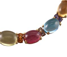 Italian made 18k gold necklace, set with multi color gemstone cabochons, including citrine, peridot, amethyst, tourmaline and topaz. DESIGNER: Not Signed MATERIAL: 18k Gold GEMSTONES: Tourmaline, Citrine, Topaz, Amethyst, Peridot DIMENSIONS: Necklace is 16.5" long and 15mm at the widest (center) point. MARKED/TESTED: 750, Italian mark. WEIGHT: 105.5 grams CONDITION: Previously Owned/Excellent Condition Amethyst Oval Multi-stone Necklace, Yellow Gold Tourmaline Multi-stone Jewelry, Gold Multi-stone Tourmaline Necklaces, Multicolor Multi-stone Tourmaline Necklace, Multicolor Amethyst Multi-stone Necklaces, Cocktail Necklace, Center Point, 18k Gold Necklace, Sign Materials