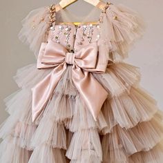 Prepare to shine in this Sequin Princess Dress Cake Dress with a silk Ribbon Bow in Beige Pink. The dress boasts a gorgeous beige-blush pink hue, embellished with shimmering sequins.Ideal for any festive event, it will make your little one feel like royalty. This dress embodies the ultimate blend of sophistication and allure, making it the perfect choice for flower girls and special occasions. Princess Dress Cake, Crinoline Skirt, Girls Birthday Party Dress, Baby Girl Princess Dresses, Cake Dress, Vestidos Color Rosa, Puffy Dresses, Girls Long Dresses, Dress Cake