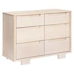 a white wooden dresser with four drawers