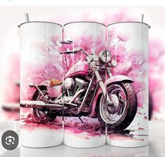 two coffee mugs with a pink motorcycle on them