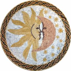 a mosaic plate with the sun and moon in it's center, on a white background