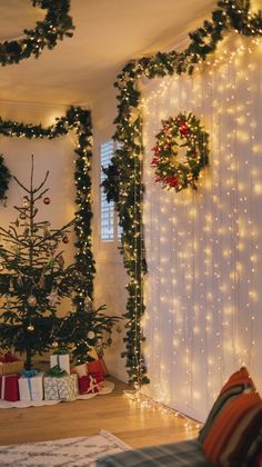 a living room decorated for christmas with lights