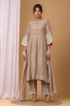 Beige pintuck pleated yoke kurta with floral embroidered sleeve. Paired with coordinating pant, inner lining and embroidered dupatta. - Aza Fashions Traditional Festive Kurta With Pintucks, Festive Traditional Kurta With Pintucks, Traditional Straight Kurta With Pintucks, Traditional Kurta With Pintucks For Eid, Eid Straight Kurta With Pintucks, Festive Cotton Kurta With Pintucks, Eid Pintucks Straight Kurta, Traditional Sets With Pintucks For Eid, Traditional Eid Sets With Pintucks