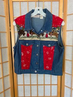 Very fun 1990’s denim top/vest with bandana and rodeo themed details. Labeled size smallBust: 38” or smallerWaist: 36” or smallerShoulder to hem: 18.5” Vintage Medium Wash Tops For Rodeo, Vintage Denim Top For Rodeo, Vintage Red Tops For Rodeo, Red Summer Top For Rodeo, Red Top For Summer Rodeo, Western Red Tops For Spring, Western Style Red Tops For Spring, Spring Western Red Tops, Cream Linen Dress