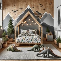 a child's bedroom with dinosaurs and mountains on the wall