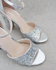 Sparkly glitter block heel sandals are perfect for date night, parties, or any special occasion.DETAILS:HEELS: 3.6 inchesCOLORS AVAILABLE: White, Silver, Gold, Rose Gold, Burgundy and NavyUPPER: Synthetic upper and liningMATERIALS: Mandmade outsoleORIGIN: ImportedSTYLE NAME: LAUREN Summer Open Toe Glitter Wedding Shoes, Summer Prom Sandals With Glitter, Party Glitter Closed Toe Sandals, Closed Toe Glitter Sandals For Party, Sparkling Block Heel Heels For Gala, Summer Wedding Shoes With Glitter And Ankle Strap, Glamorous Round Toe Sandals For Prom, Summer Wedding Shoes With Glitter Ankle Strap, Summer Wedding Shoes With Ankle Strap And Glitter