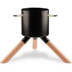 a black pot sitting on top of a wooden tripod with two handles and legs