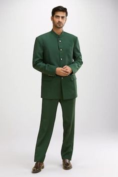 Bottle green bandhgala with emblem buttons. Comes with coordinating pant. - Aza Fashions Elegant Green Semi-formal Kurta, Formal Green Sets For Diwali, Traditional Green Unstitched Suit For Formal Occasions, Green Traditional Unstitched Suit For Formal Occasions, Green Traditional Semi-formal Sets, Green Sets For Groom For Eid, Green Sets For Groom On Eid, Green Formal Sets For Festive Occasions, Green Formal Unstitched Suit For Diwali