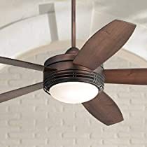 a ceiling fan with a light on it in front of a brick wall and ceiling fan