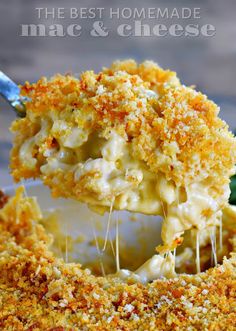 the best homemade macaroni and cheese is being lifted with a fork from a casserole dish