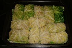 cabbage rolls in a baking pan ready to go into the oven