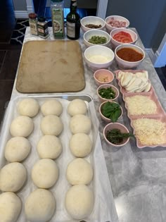 doughnuts and other ingredients are on the counter in front of a baking sheet