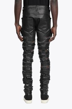 Rick Owens DRKSHDW Spartan Jeans Designer's ID: DU01B7360-SBKM With a snug skinny fit and low rise, these jeans hug all the right curves. The unique Spartan design is sure to turn heads, with horizontal raw cut straps interlocking with vertical straps running up the centre back and legs. Plus, the light-weight stretch denim has a black matte finish that's just irresistible. Color: Black Composition: 91% COTTON+6% ELASTOMULTIESTE, 3% RUBBER. Made In ITALY Edgy Ripped Fitted Jeans, Fitted Punk Jeans For Streetwear, Punk Style Fitted Jeans For Streetwear, Fitted Punk Style Jeans For Streetwear, Ripped Fitted Punk Jeans, Punk Ripped Fitted Jeans, Urban Fitted Distressed Bottoms, Urban Fitted Distressed Pants, Punk Style Ripped Fitted Jeans