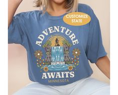 Introducing our custom Adventure Awaits shirt. This adventure shirt is a Comfort Colors tee. It makes a great camping gift or perfect for anyone who loves an adventure. Customize with a location. Whether you're hiking in the mountains or hanging out with friends, make a statement with this Wanderlust t-shirt. The soft-washed, garment-dyed fabric brings extra coziness to your wardrobe while the relaxed fit makes it an excellent daily choice. The double-needle stitching throughout the tee makes it Best Tote Bags, Mountain Tshirt, Adventure Shirt, Camping Gifts, Comfort Colors Tee, Dyed Fabric, Adventure Awaits, In The Mountains, Nature Lover