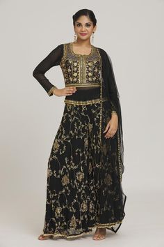 Black kurta with floral embroidery and tassels. Paired with flared pant and dupatta.
Components: 3
Pattern: Embroidered
Type Of Work: Floral
Neckline: Round
Sleeve Type: Full
Color: Black
Other Details: 
Curved hem
Tassels
Occasion: Mehendi and Haldi - Aza Fashions Floor-length Embroidered Sets For Eid, Embroidered Floor-length Sets For Eid, Elegant Embroidered Maxi Choli, Elegant Embroidered Maxi Length Choli, Elegant Maxi Length Embroidered Choli, Navratri Floor-length Sets With Floral Embroidery, Bollywood Style Maxi Length Sharara With Intricate Embroidery, Festive Floor-length Choli With Floral Embroidery, Bollywood Style Festive Floral Embroidered Choli