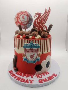 a soccer themed birthday cake for a liverpool fan