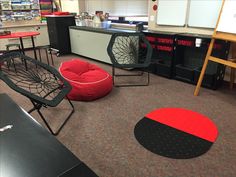 a room with chairs, tables and other items on the floor in front of them