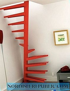 there is a very tall red staircase in the room