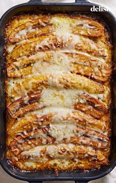 a casserole dish filled with meat and cheese