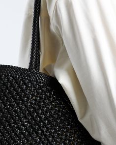 Made by hand in Italy Distinction is all in the detail and, for us, that exterior strap elevates this classic to the realms of enduringly cool. Wear with everything. Description Unstructured tote, woven by hand using a single length of smooth black Italian leather. Free of hardware, and unlined for lightness. Details Black nappa (open weave). Unlined. No Internal pockets. Handles: 2 Fixed shoulder straps (woven). Made by hand in Italy Size & Fit Length: 41cm Width: 33cmDepth:1cmHandle: 25.5cm ha Luxury Open Weave Bag For Everyday Use, Luxury Open Weave Shoulder Bag, Elegant Black Shoulder Bag With Interwoven Design, Elegant Black Bag With Interwoven Design, Everyday Black Shoulder Bag With Intrecciato Weave, Elegant Everyday Bag With Interwoven Design, Chic Black Shoulder Bag With Open Weave, Black Intrecciato Weave Shoulder Bag For Everyday, Modern Black Handwoven Bag