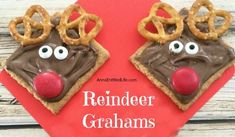 reindeer graham crackers with chocolate frosting and pretzels on top, ready to be eaten