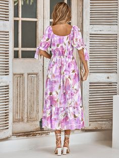 We are swooning over our Tanya Painting Floral Maxi Dress. The billowy sleeves with a bow tie make this gown silhouette ultra flattering. Features a purple lavender base with multi colored florals. Size Guide: Tina is 5’65” tall, and has a 33.6” bust, 24.1” waist, & 35.2” hips. She is wearing a S / US 4 / AU 8. This dress is true to size. Material: 100% Polyester. Feature: V-neckline. Maxi length. Tie-bow sleeve. Maternity friendly. Care Instructions: Machine wash / Cold hand wash Chic Bow Print Dresses For Spring, Elegant Spring Dresses With Bow Print, Elegant Bow Print Dresses For Spring, Feminine Bow Print Spring Dresses, Feminine Spring Dresses With Bow Print, Fitted Bow Print Summer Dress, Spring Brunch Midi Dress With Bow, Spring Midi Dress With Bow For Brunch, Fitted Midi Dress With Bow For Garden Party