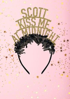 the words kiss me at midnight are made out of black bows and glitters on a pink background