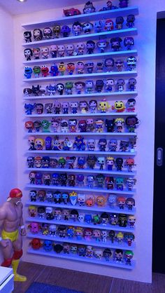 there is a large collection of toys on the wall